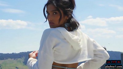 An Indian MILF model undresses outdoors and plays with a hose